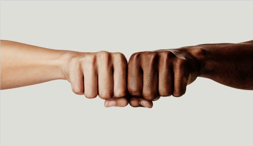 A fist bump between two people
