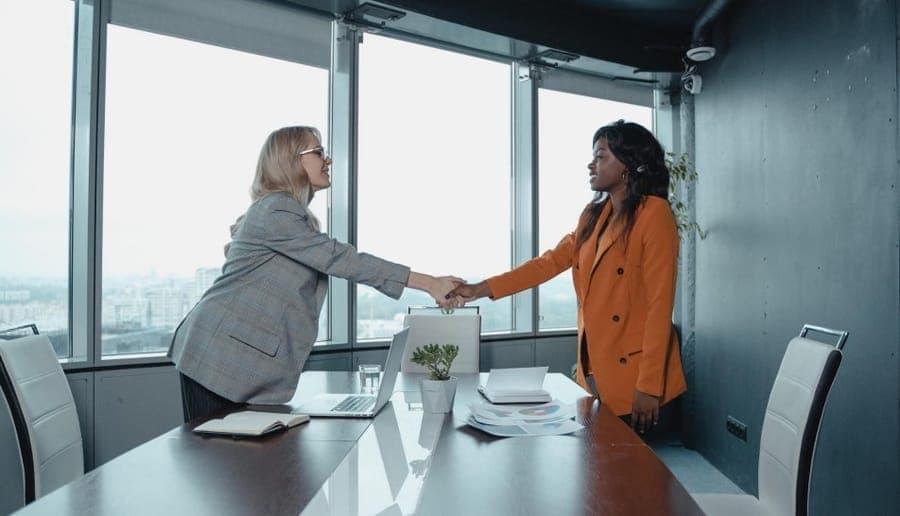 A handshake across an interview table