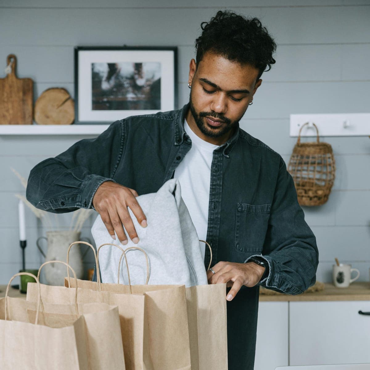 A man unpacking his shopping