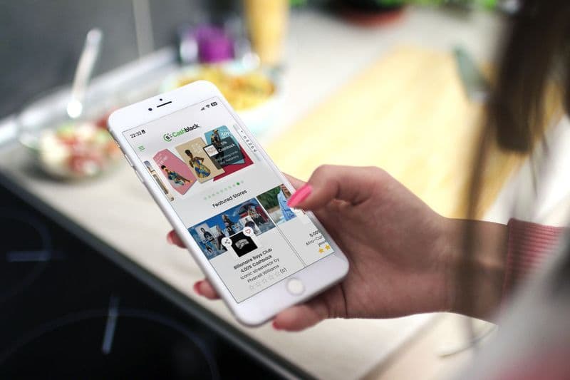 The Cashblack app open on a phone in a shopper's hand